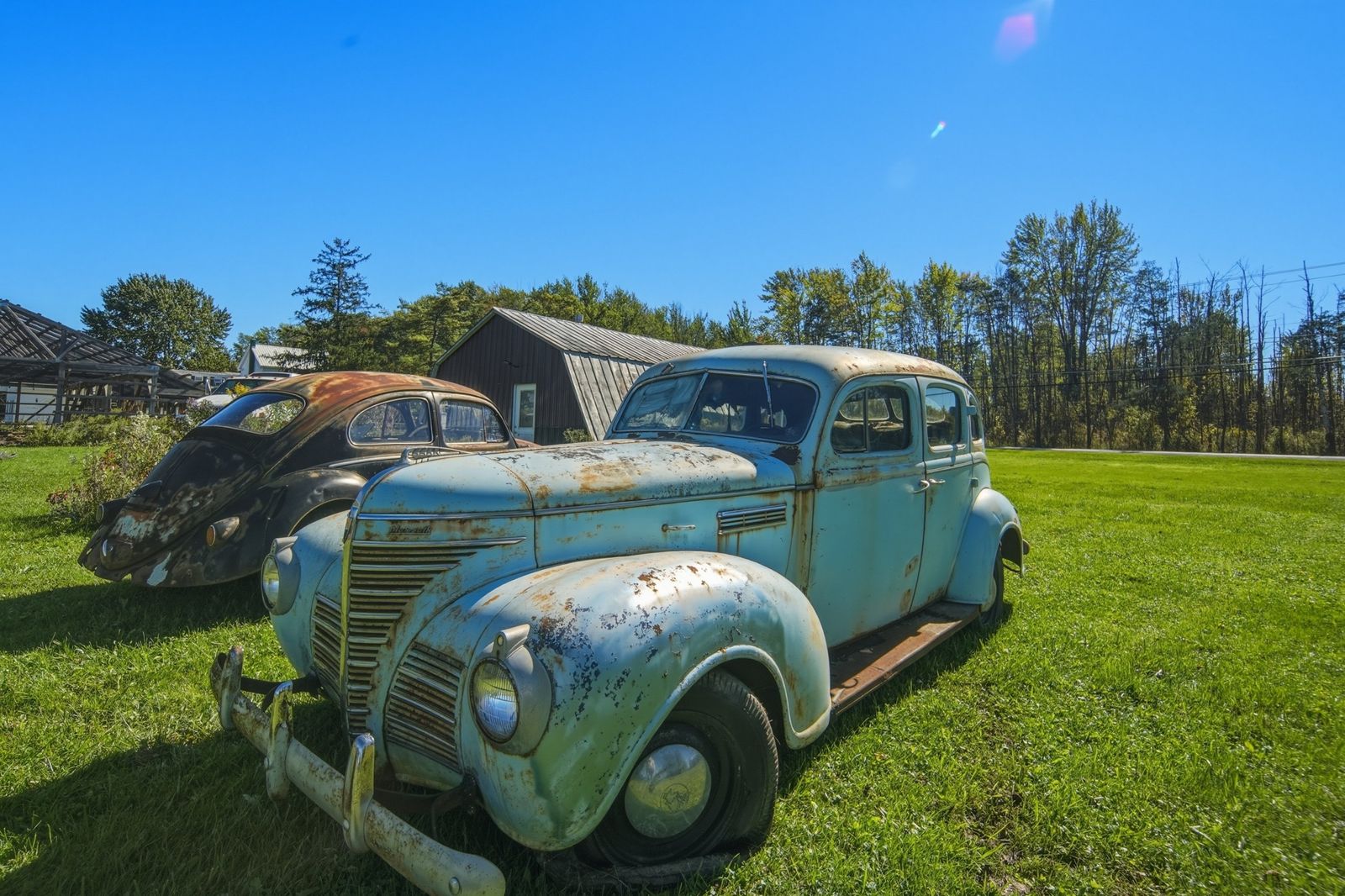 Antique Plymouth and VW Beetle on the Bridgeport property
